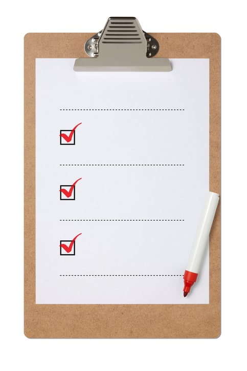 Blank checklist on clipboard with three red check marks