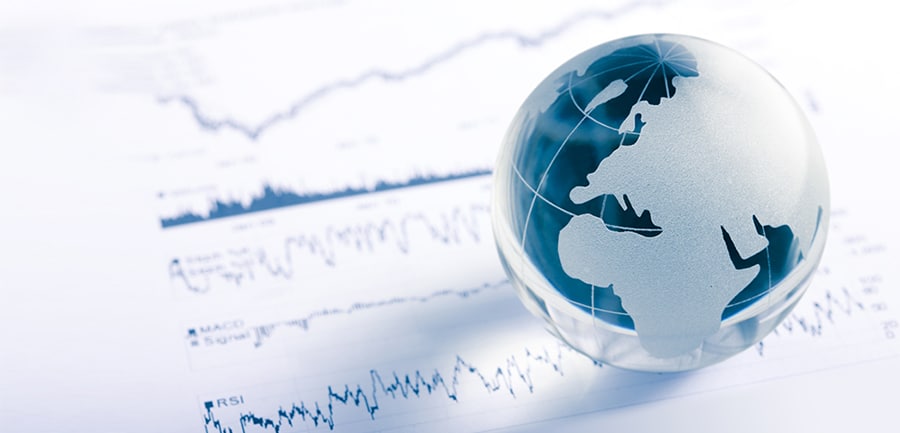 Glass Globe Resting On A Stock Chart