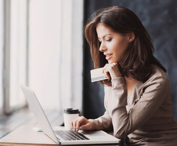 Woman Is Shopping Online With Laptop