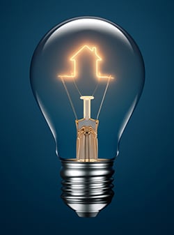 Light Bulb With Filament Forming A House Icon