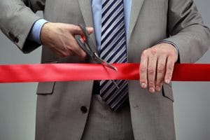 New Business Venture Cutting A Red Ribbon